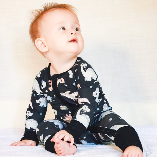 Dinosaur baby pajamas with mobility friendly zipper